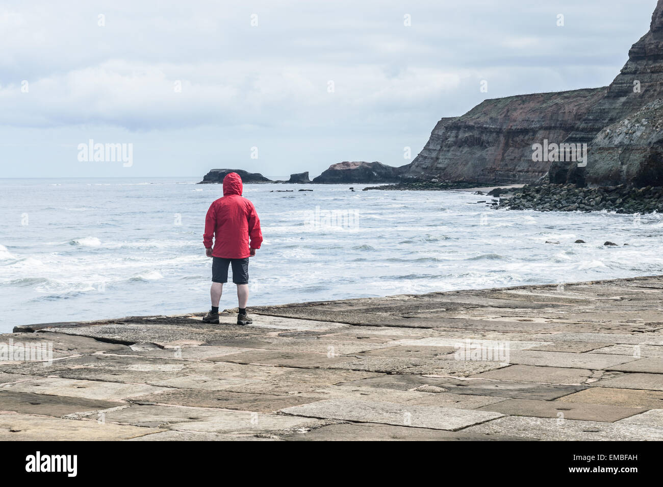 Person wearing red jacket hi-res stock photography and images - Alamy