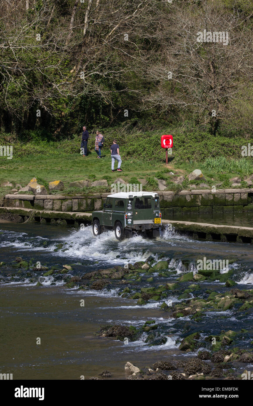 Land Rover 4WD crossing the tidal ford below the dam at Lopwell Dam, Devon. Stock Photo