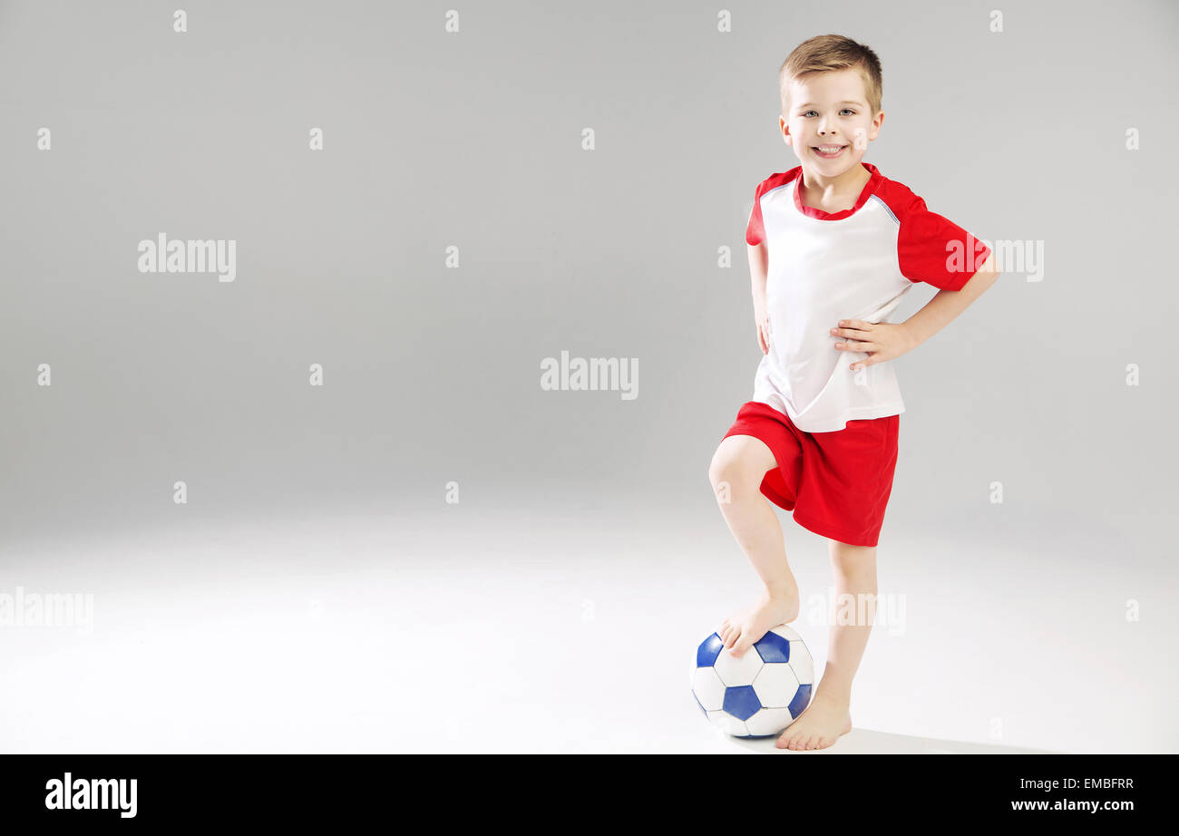 Cute kid playing the soccer Stock Photo