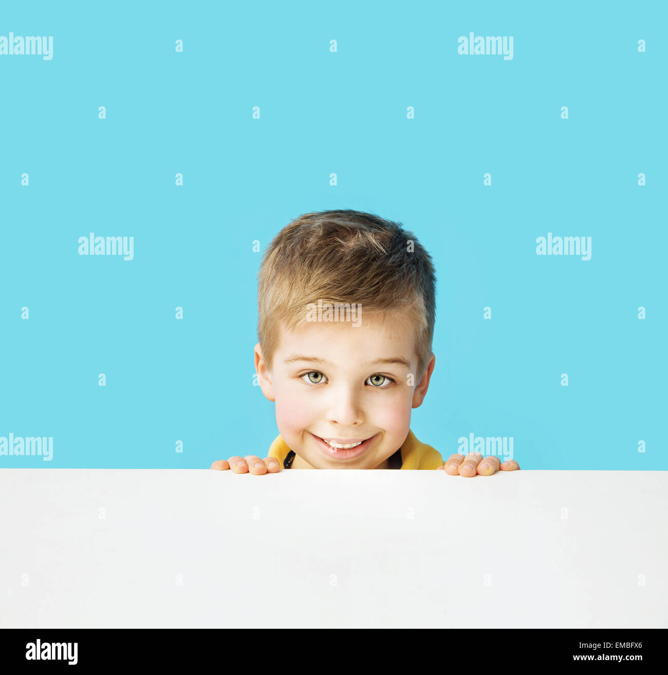Small and cute smiling boy making faces Stock Photo