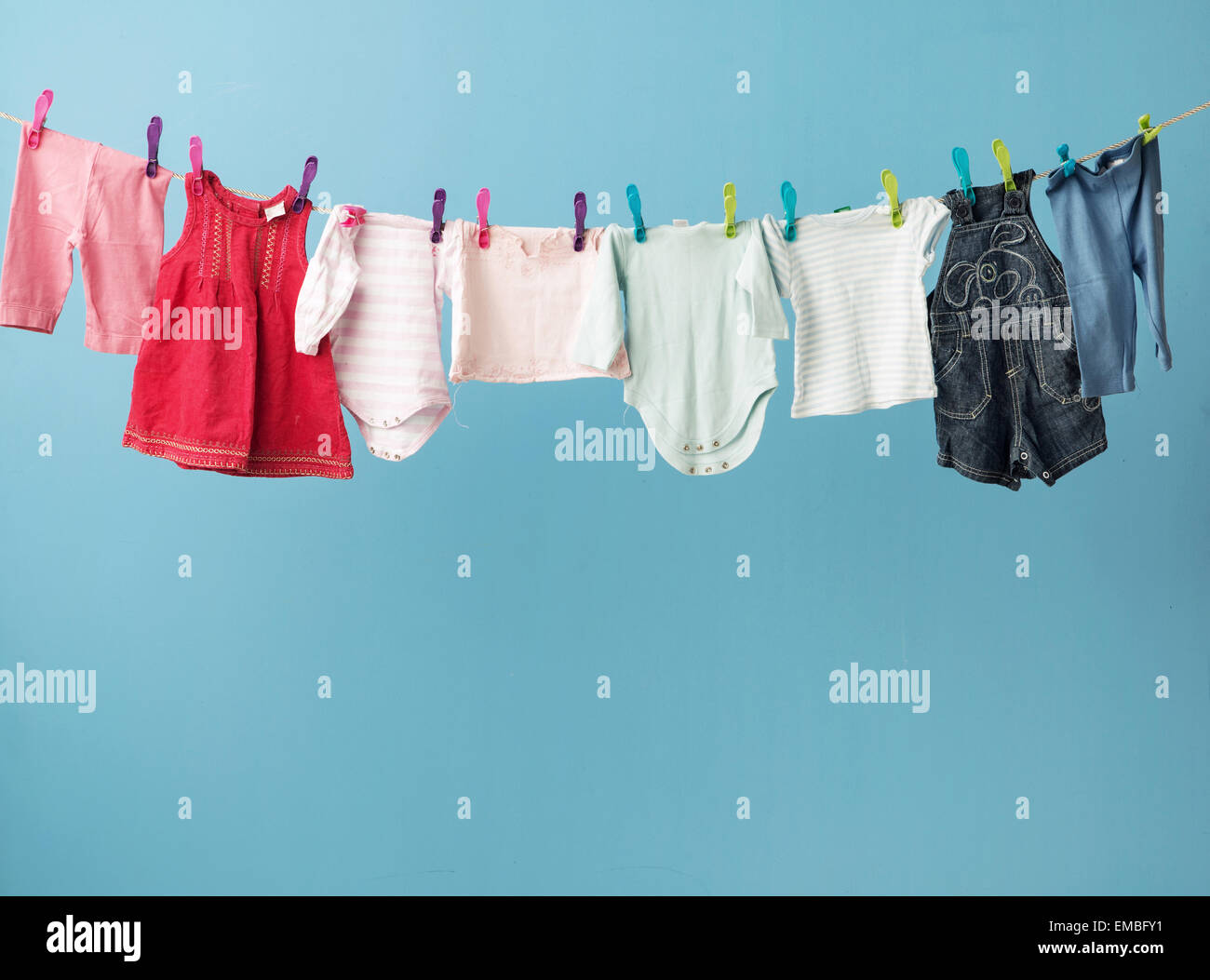 Wet toddler's clothes getting dry Stock Photo - Alamy