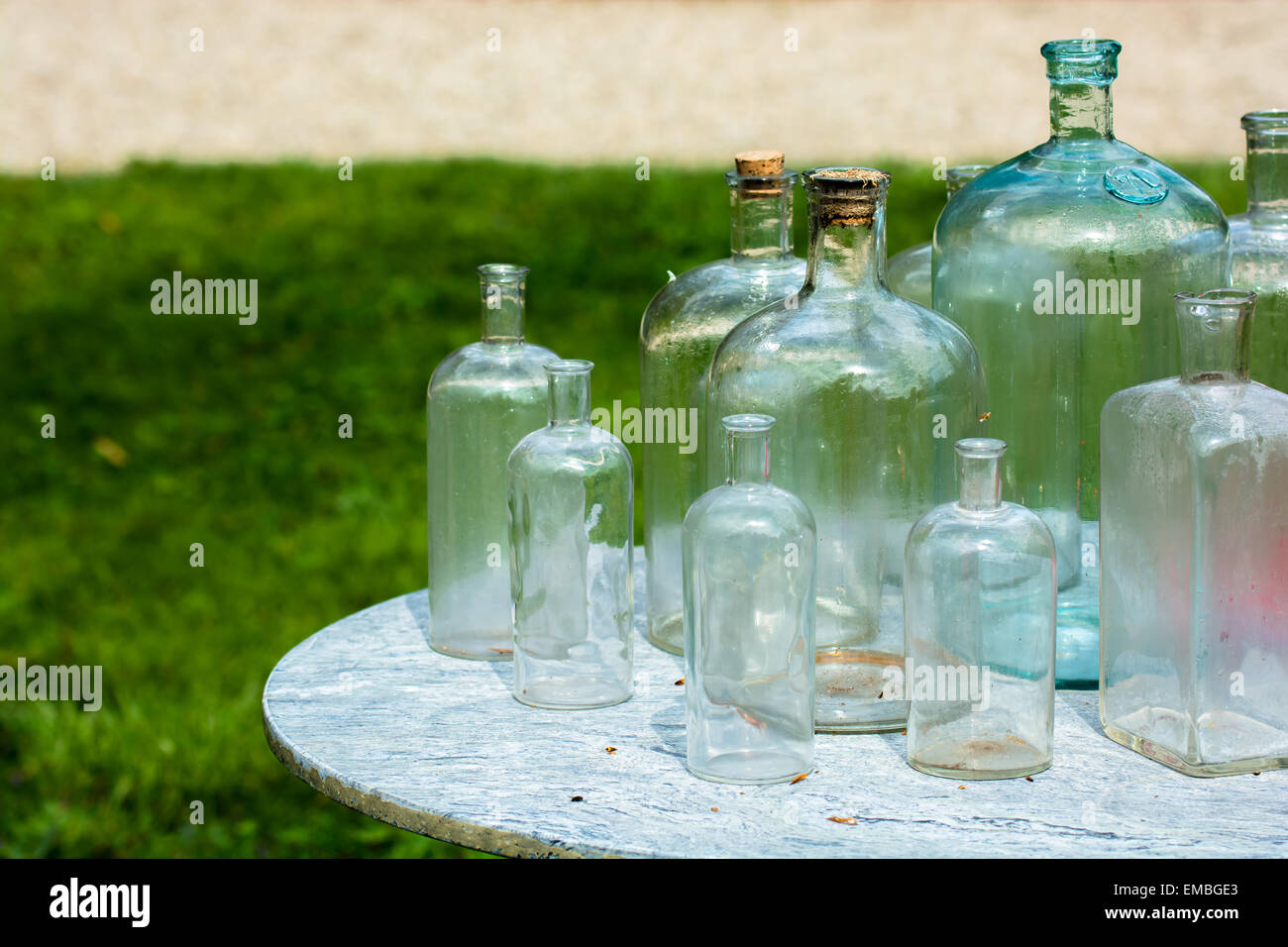 Vintage Bottles Outdoor On Table Stock Photo