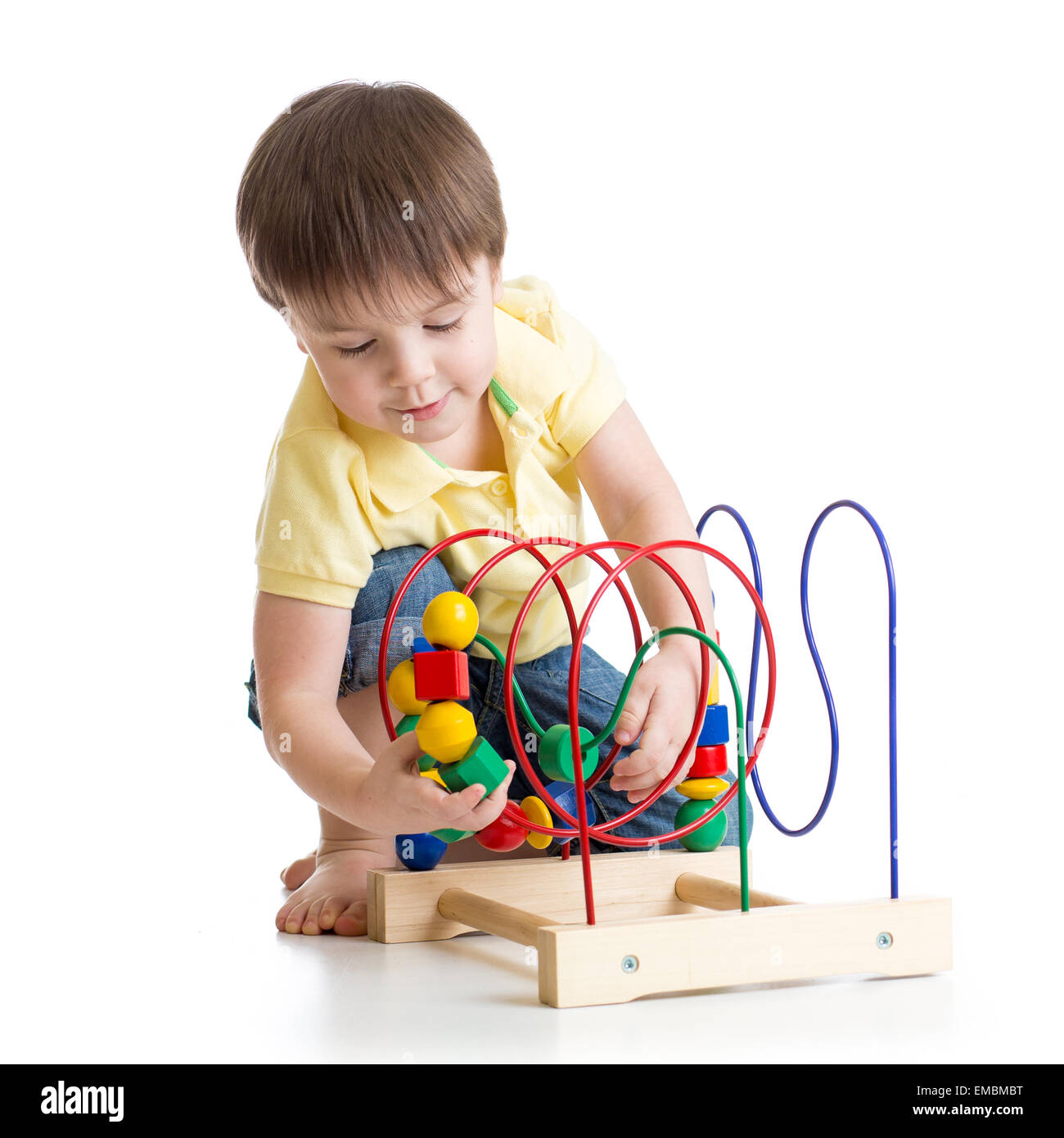 child boy playing with colorful toy Stock Photo - Alamy