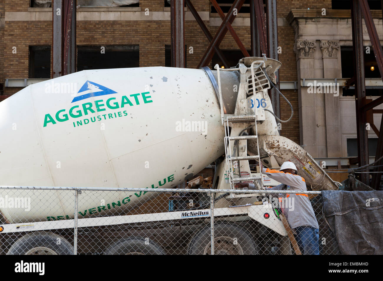 Man operating a reardischarge concrete transport truck USA Stock