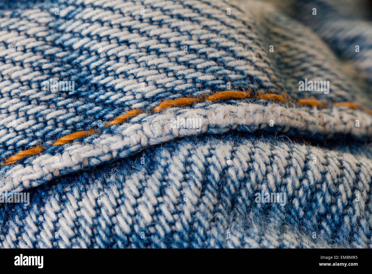 Seam on blue jean denim fabric Stock Photo