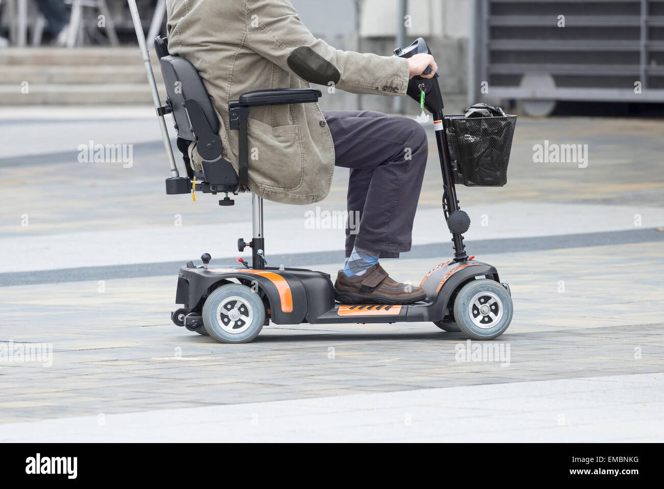Cruise ship passenger using mobility scooter supplied by ship Stock