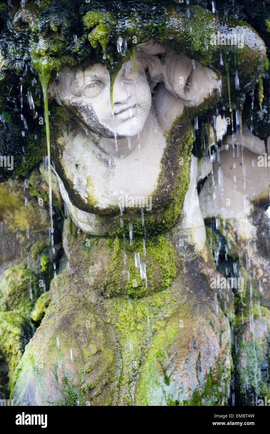 Decorative fountain covered in Algae Stock Photo Alamy