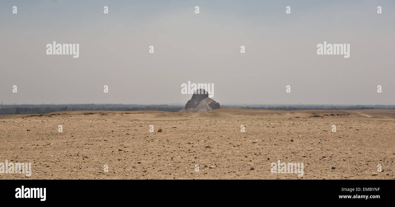 The Pyramid of Meidum or Maidum is a location of a large pyramid, and several large mud-brick mastabas. It was originally built Stock Photo