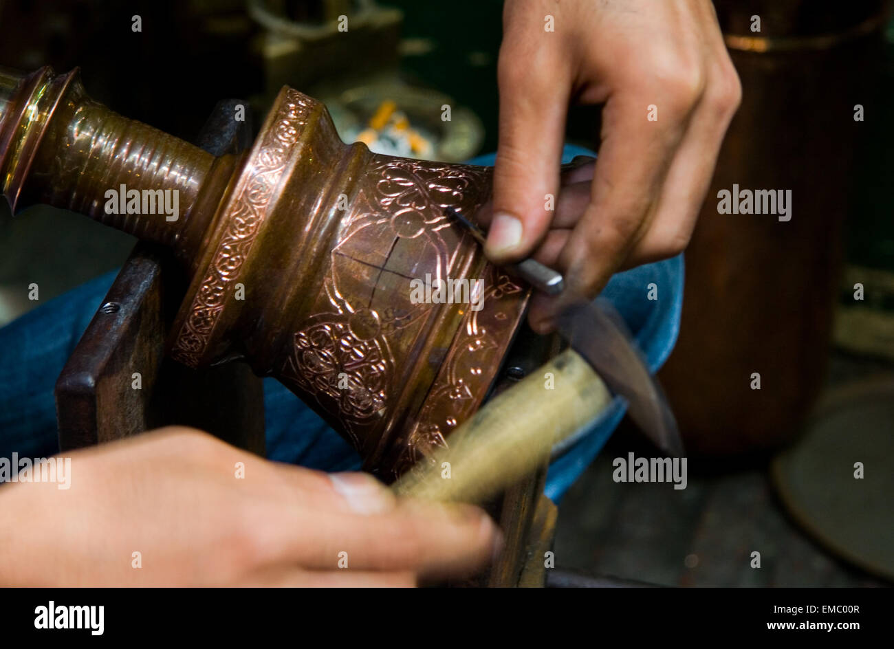 Hands of turkish chaser in process of oriental design calking, Istanbul ...