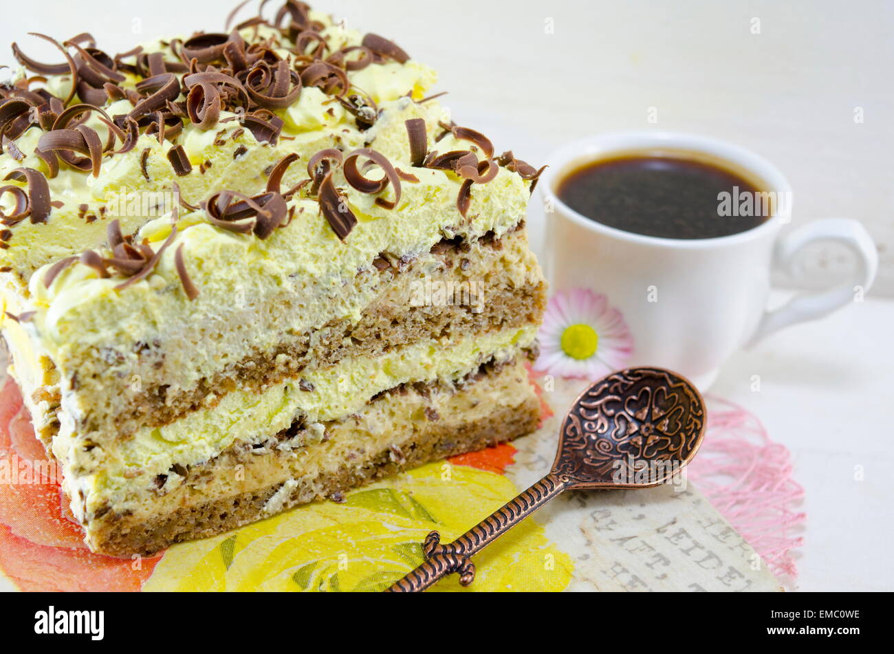 Cappuccino cake on a plate with a cup of coffee Stock Photo