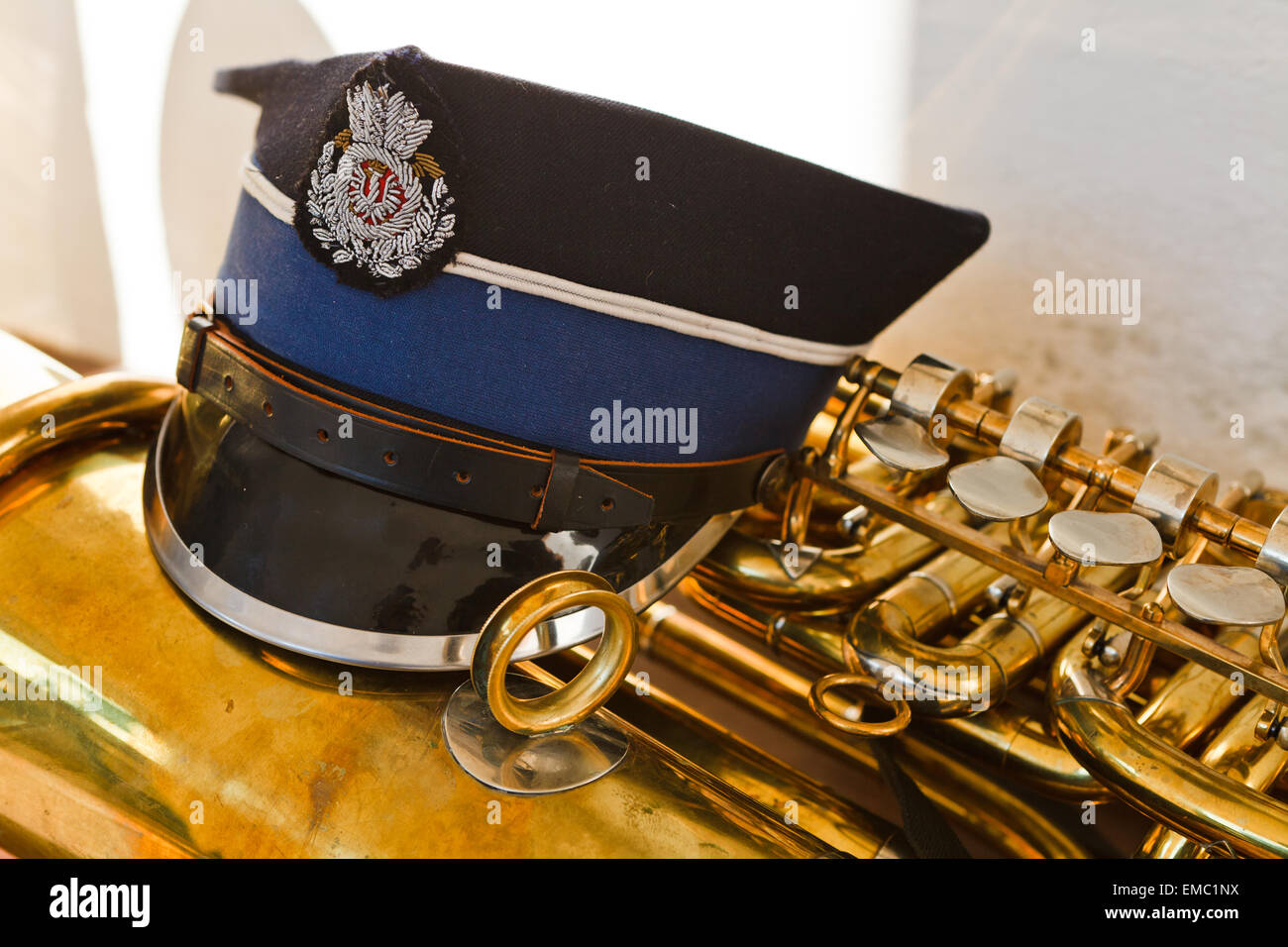 Musician peaked hat on trumpet Stock Photo