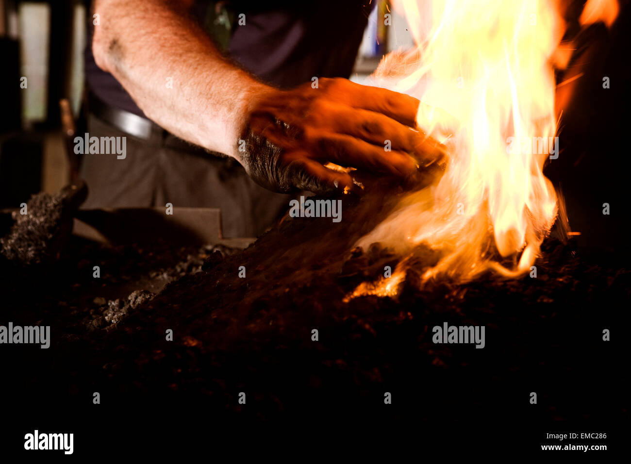 Blacksmith at work at the fireplace Stock Photo Alamy