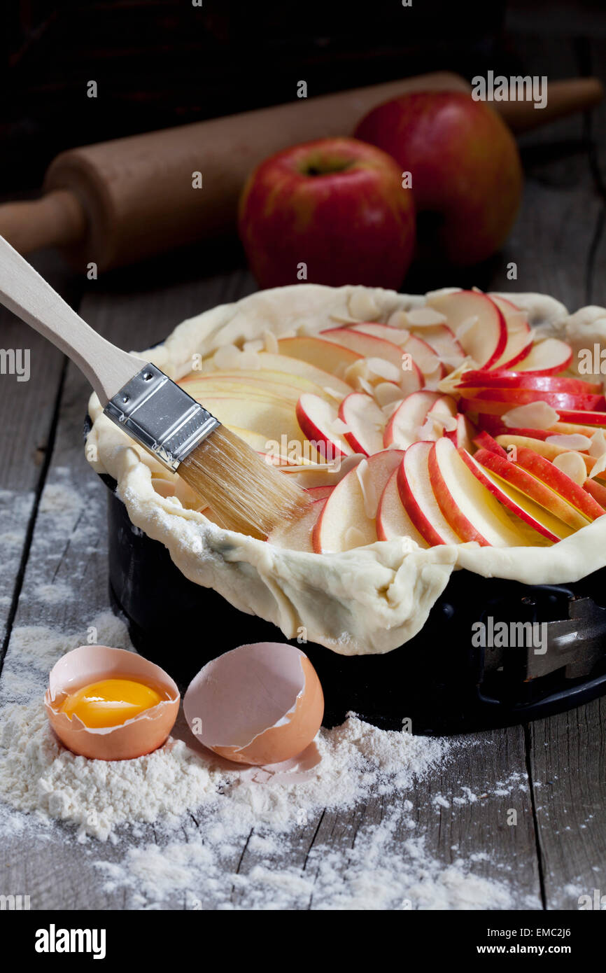 Raw apple pie in cake pan and ingredients on wood Stock Photo Alamy