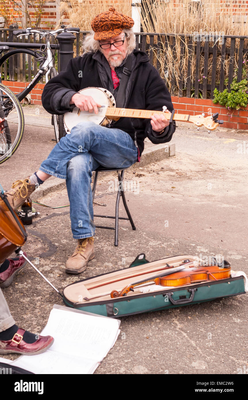 A man busking with a banjo in Southwold , Suffolk , England , Britain , Uk Stock Photo