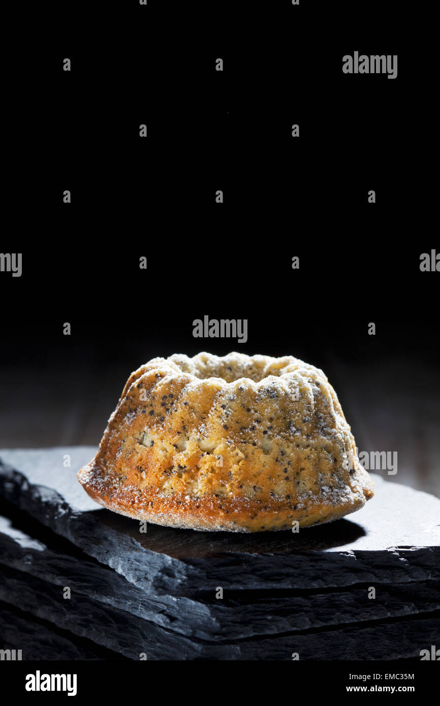 Poppy seed mini Gugelhupf on slate Stock Photo Alamy