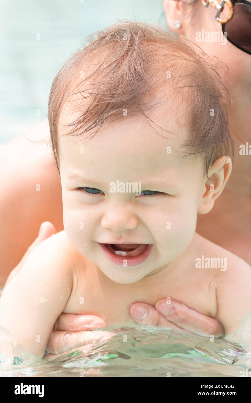 Portrait of baby girl in swimming pool Stock Photo Alamy