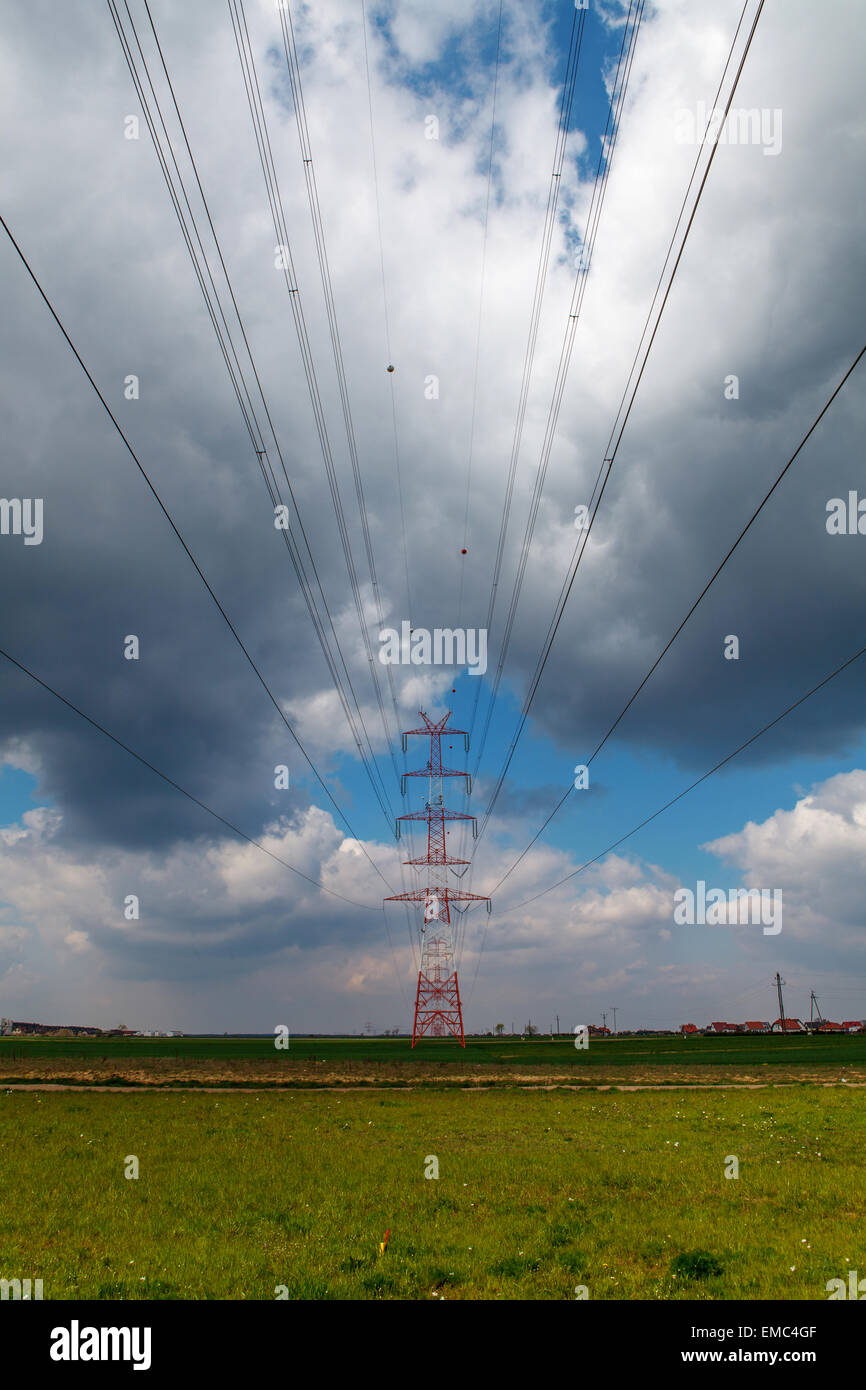 Electricity pole under cloudy sky Stock Photo - Alamy