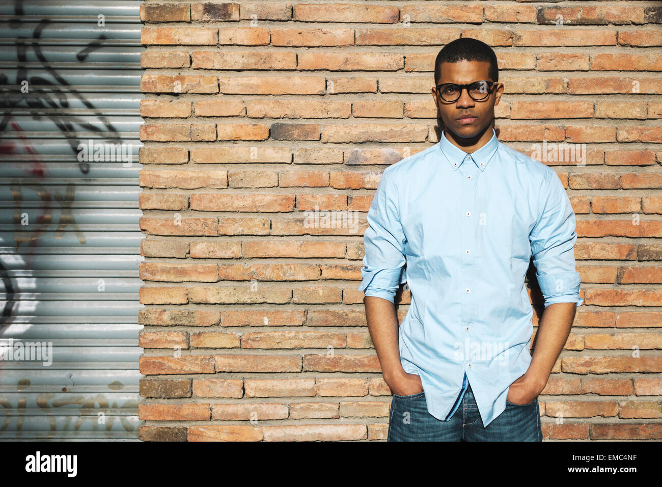 Man in glasses blue shirt hi-res stock photography and images - Alamy