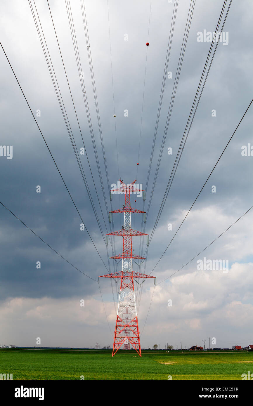Electricity pole under cloudy sky Stock Photo - Alamy