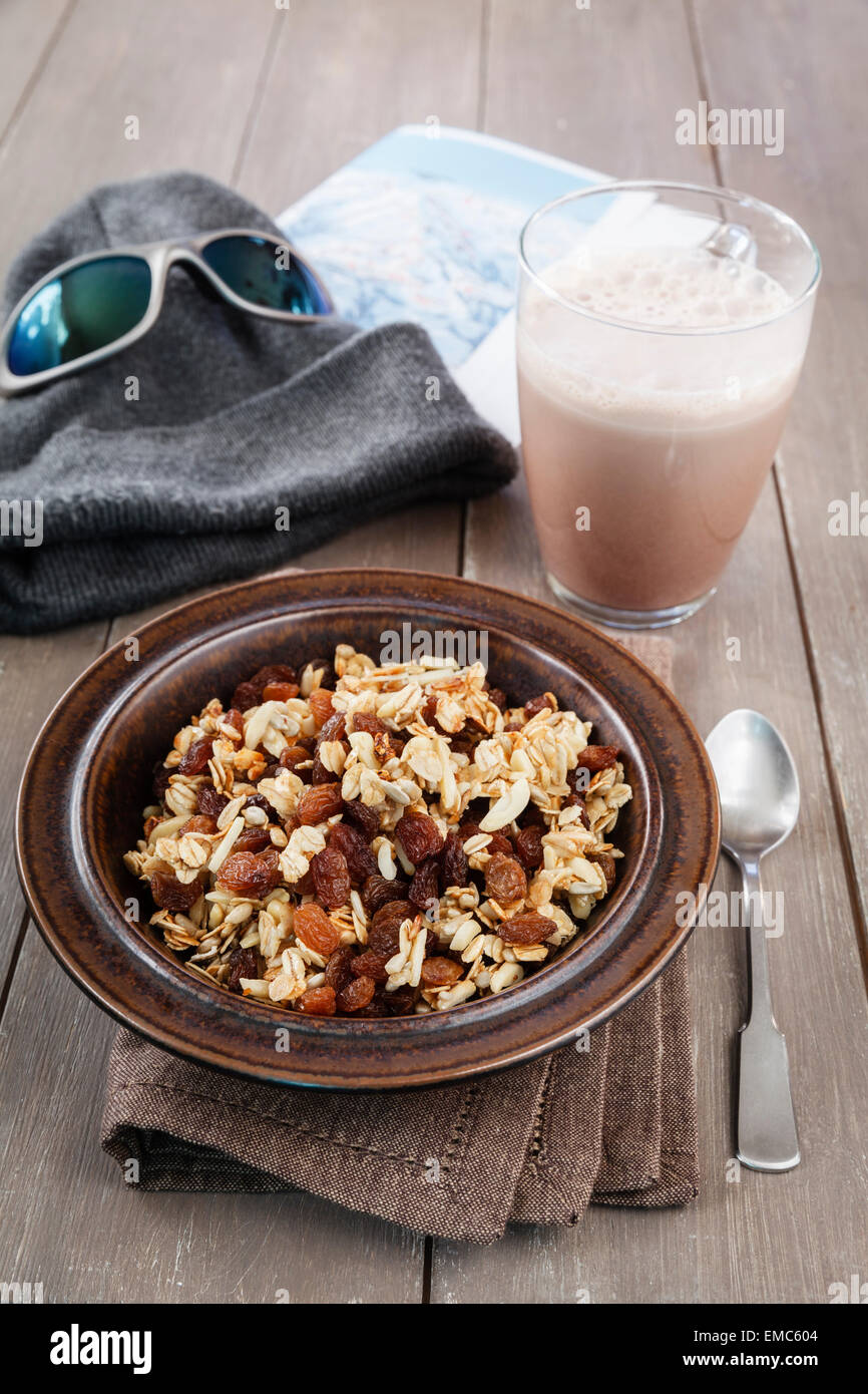 Plate of homemade granola and glass of cocoa Stock Photo