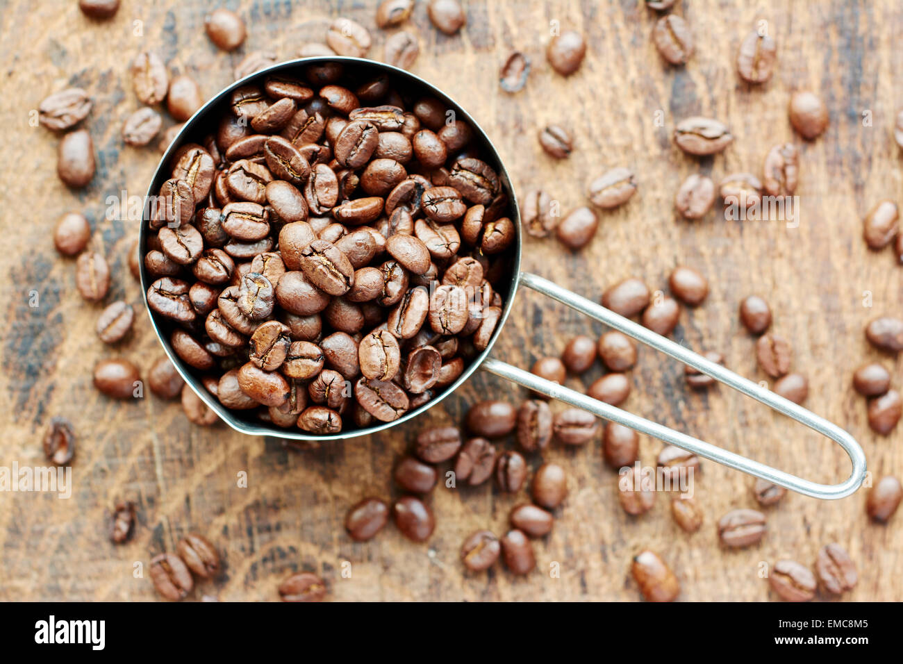 Measuring cup of coffee beans Stock Photo Alamy