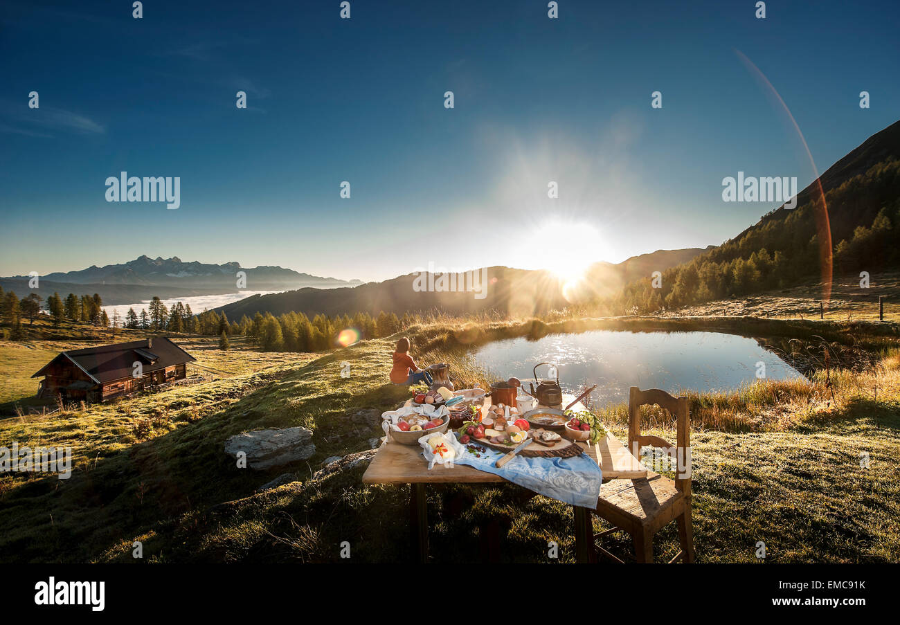 Austria, Salzburg State, Altenmarkt-Zauchensee, alpine pasture, breakfast at sunrise Stock Photo