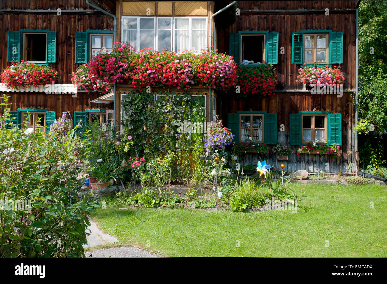 traditional wooden house with veranda and flowers in Altaussee, Styria, Austria Stock Photo