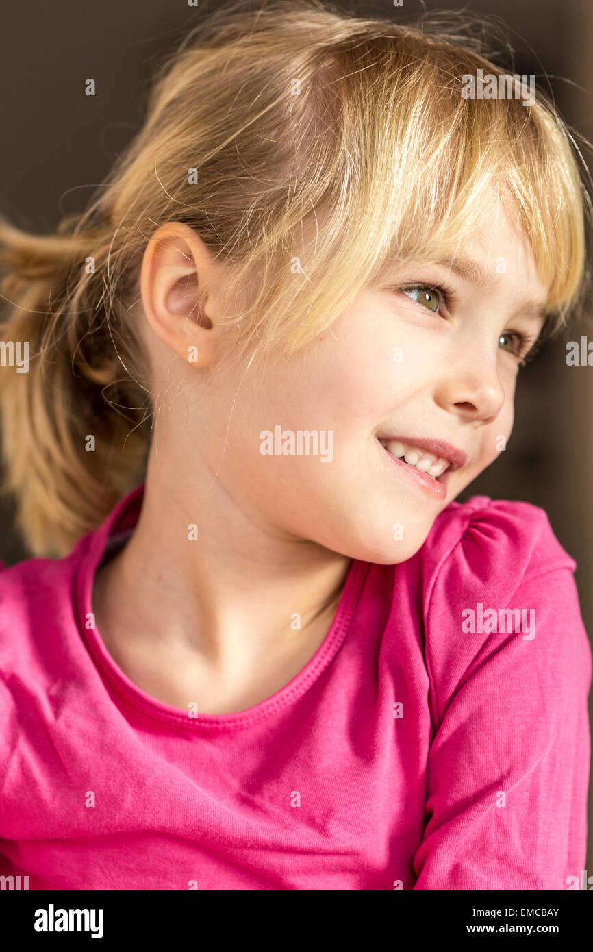 Portrait of a blond girl smiling Stock Photo - Alamy