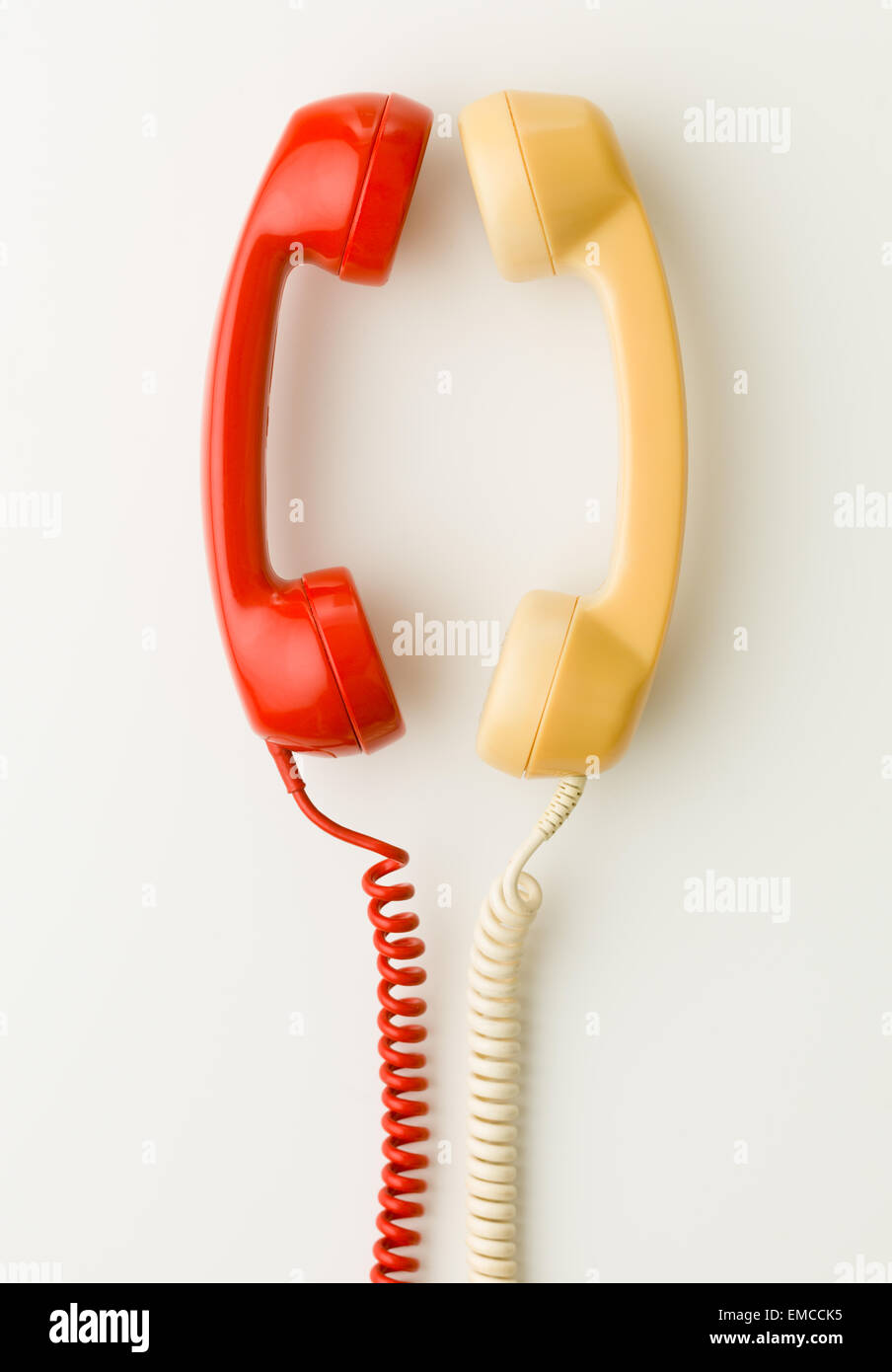 two handsets facing each other and talking Stock Photo
