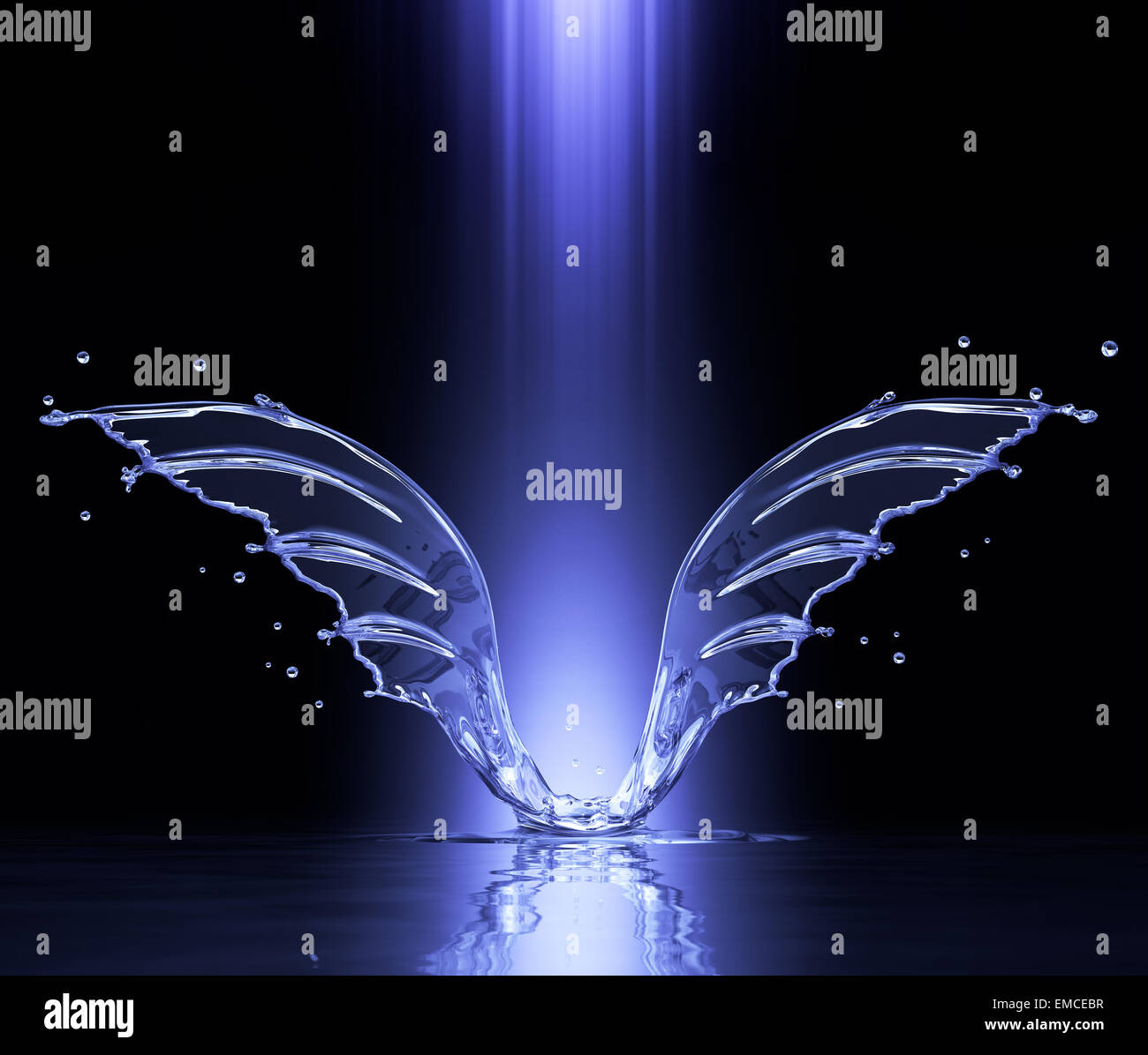 Splash in form of wings in pillar of light Stock Photo