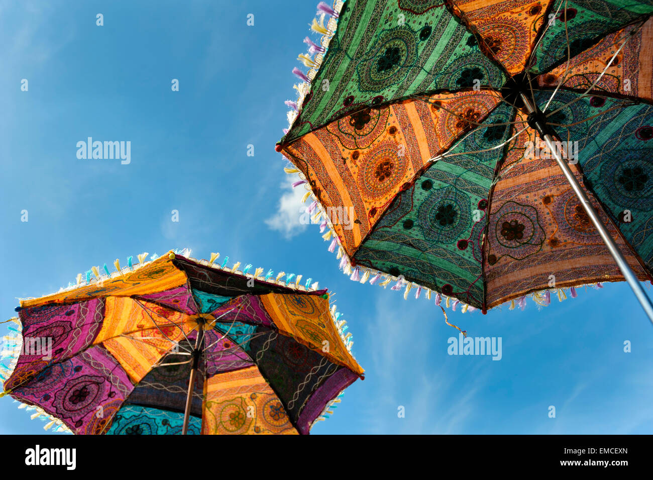 Looking up at the underside of two embroidered Indian Parasols Stock Photo