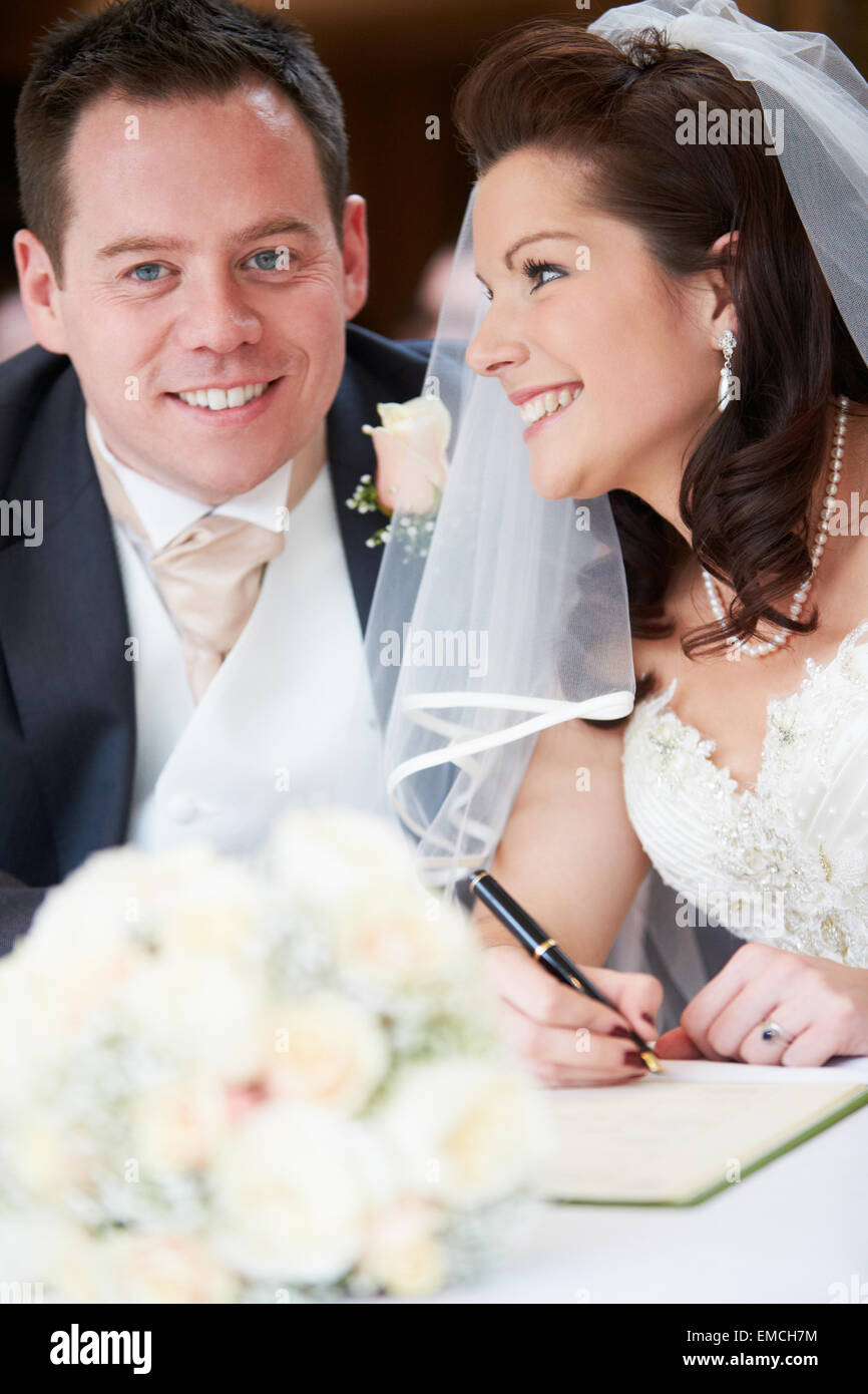 Bride And Groom Signing Wedding Register Stock Photo Alamy