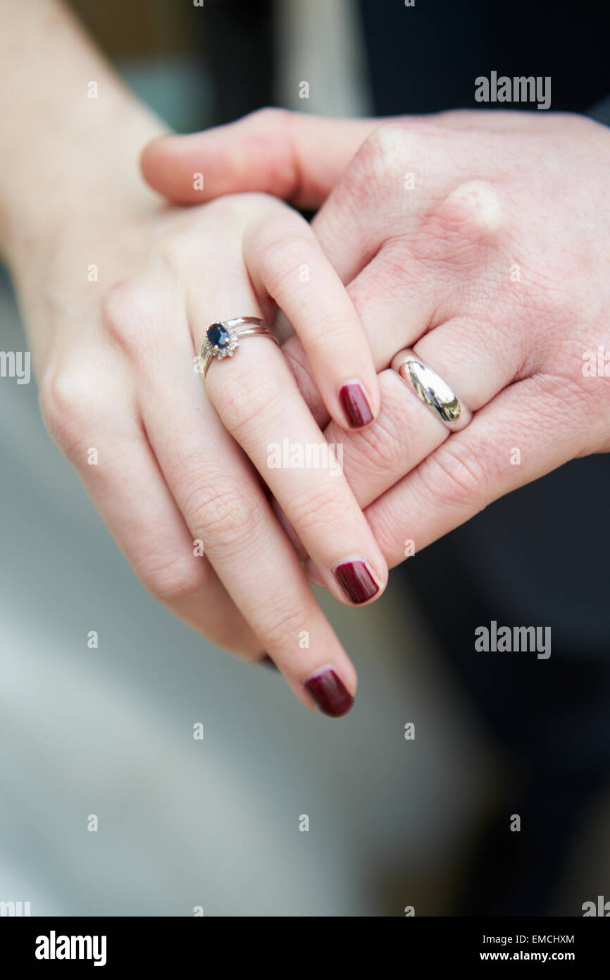 Close Up Of Bride And Groom Wearing Wedding Rings Stock Photo Alamy
