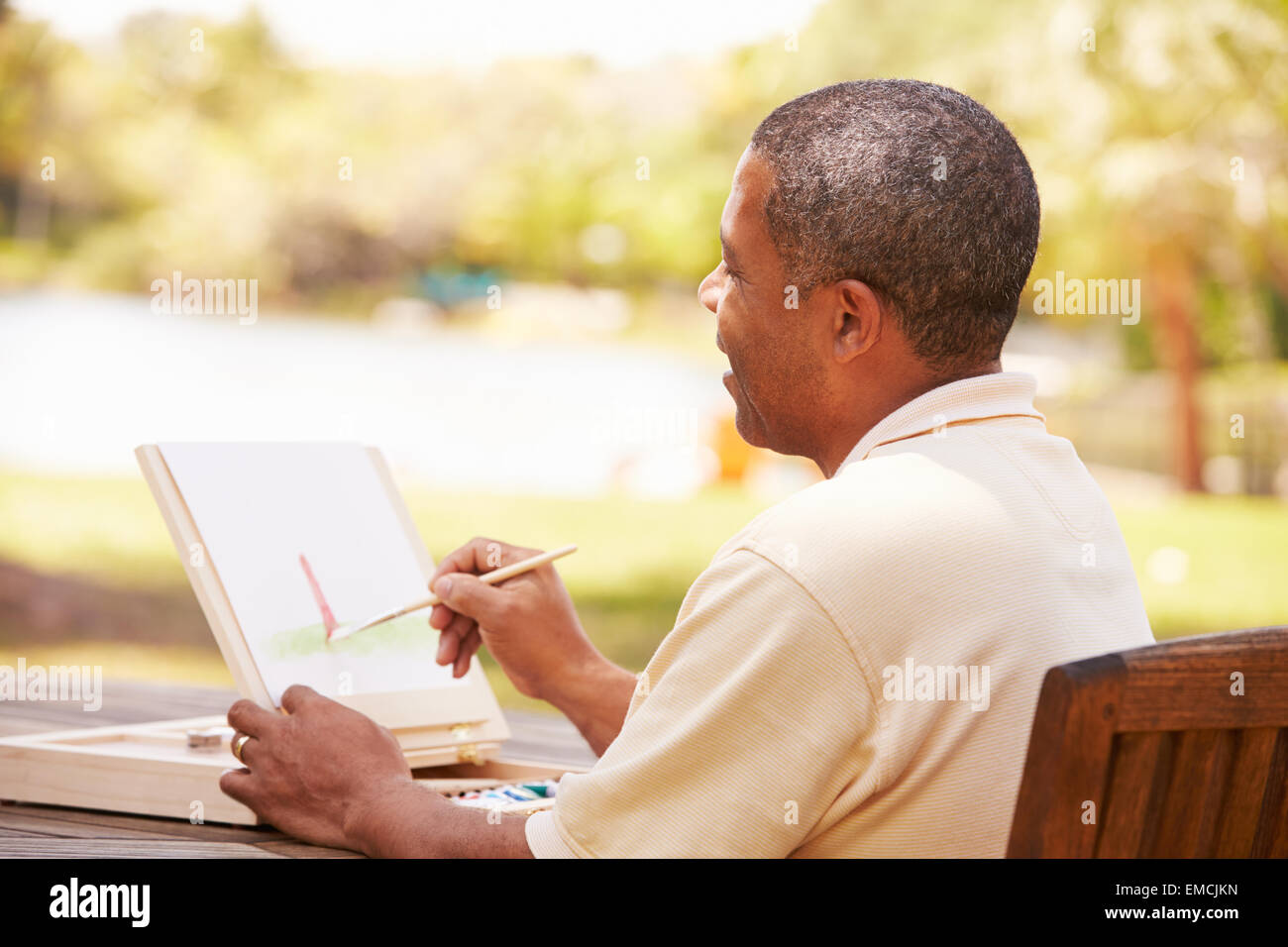 Man sitting painting hi-res stock photography and images - Alamy