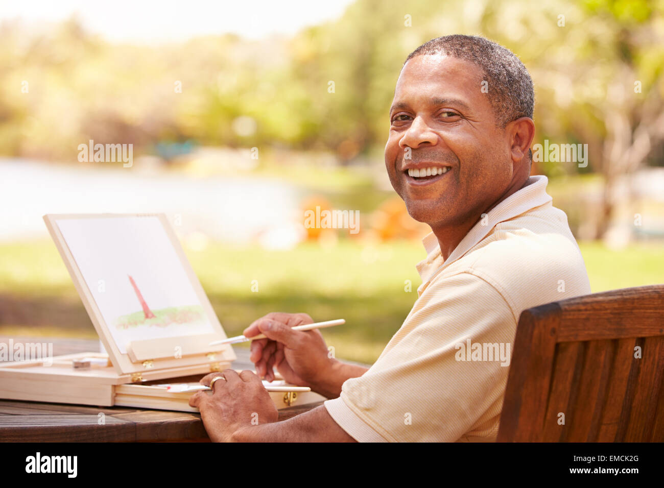 Man sitting painting hi-res stock photography and images - Alamy