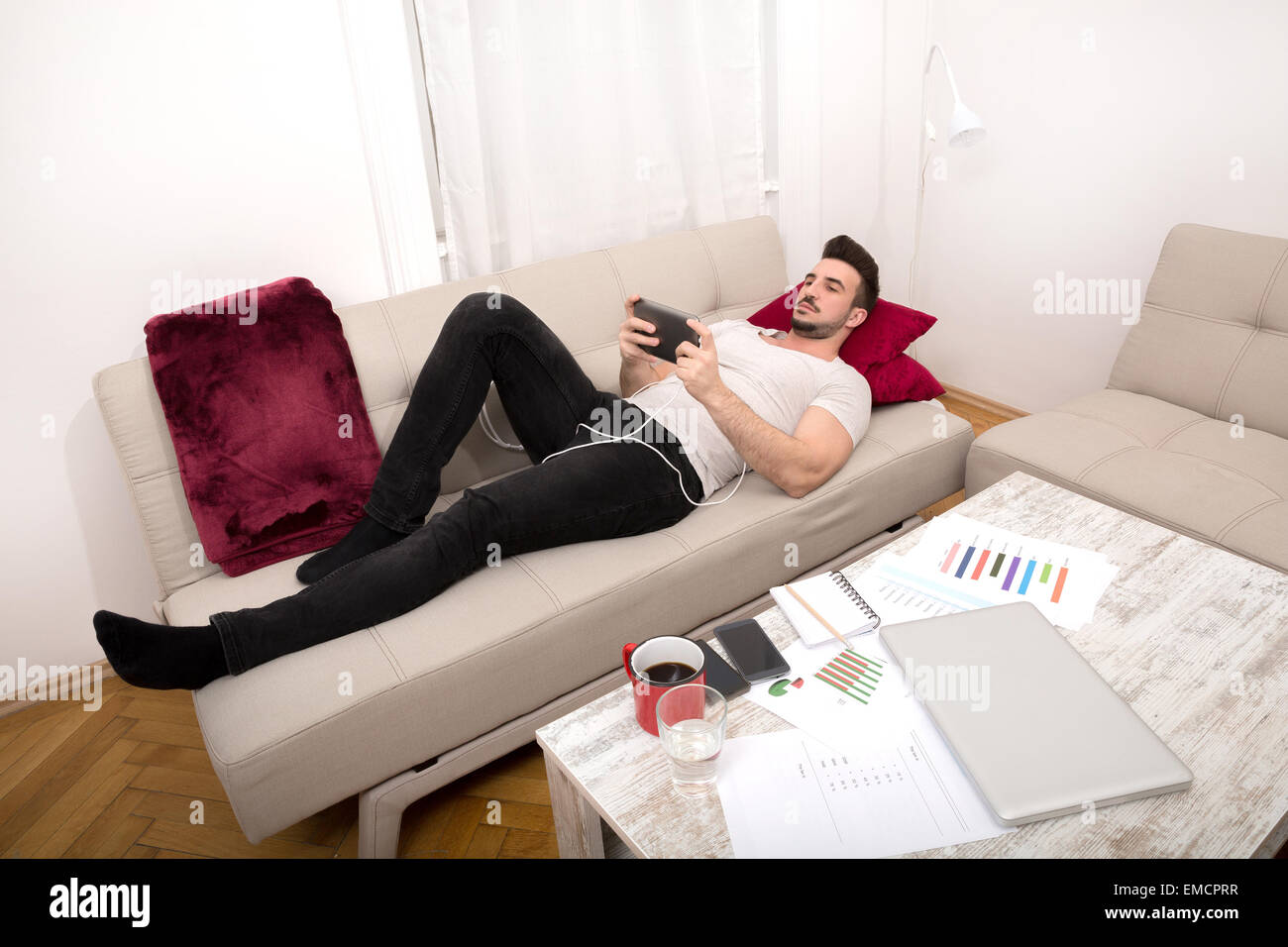 Relaxing after working long hours at home Stock Photo