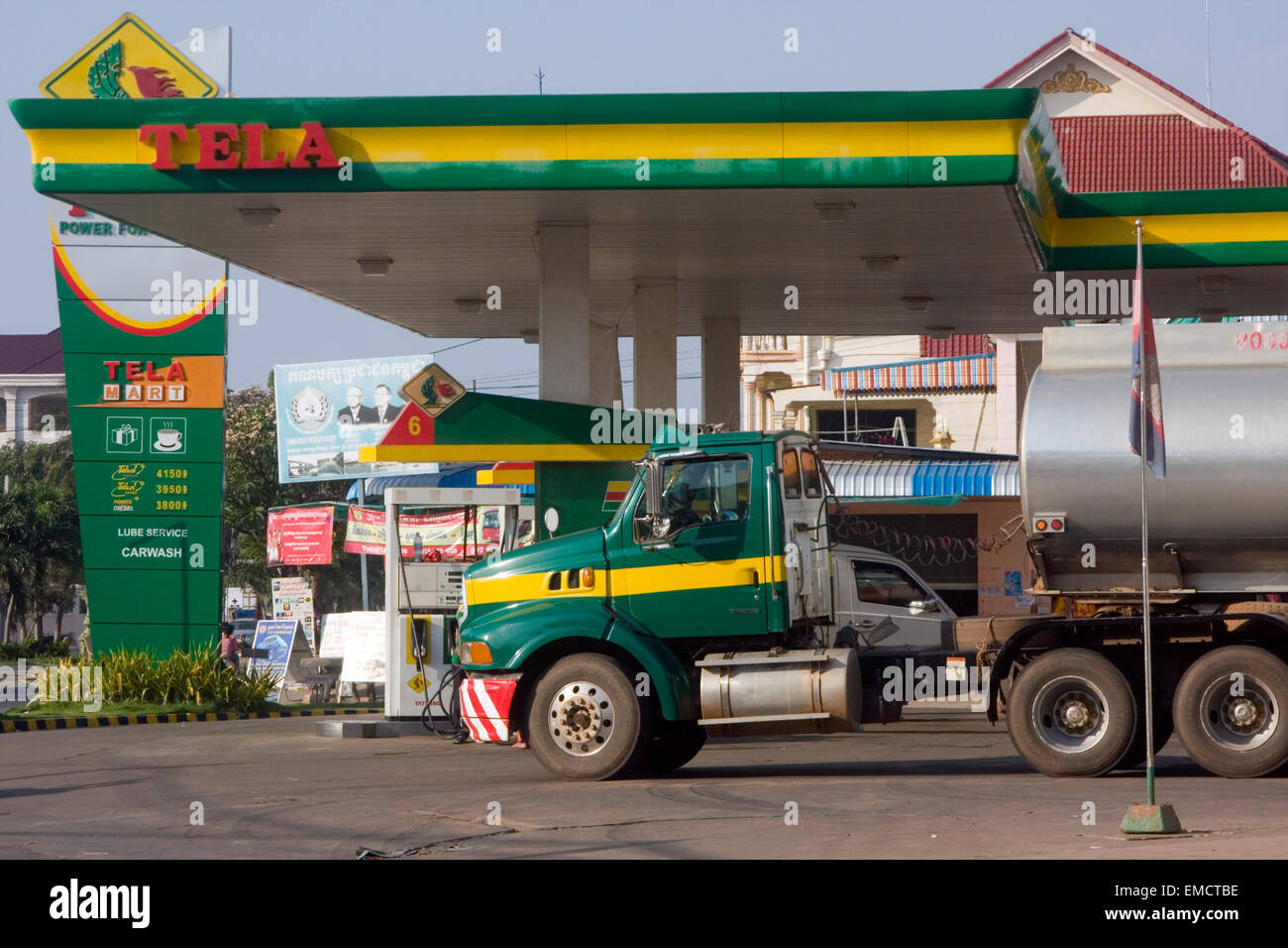 A fuel truck is parked at a Tela gas station & mini mart in Kampong