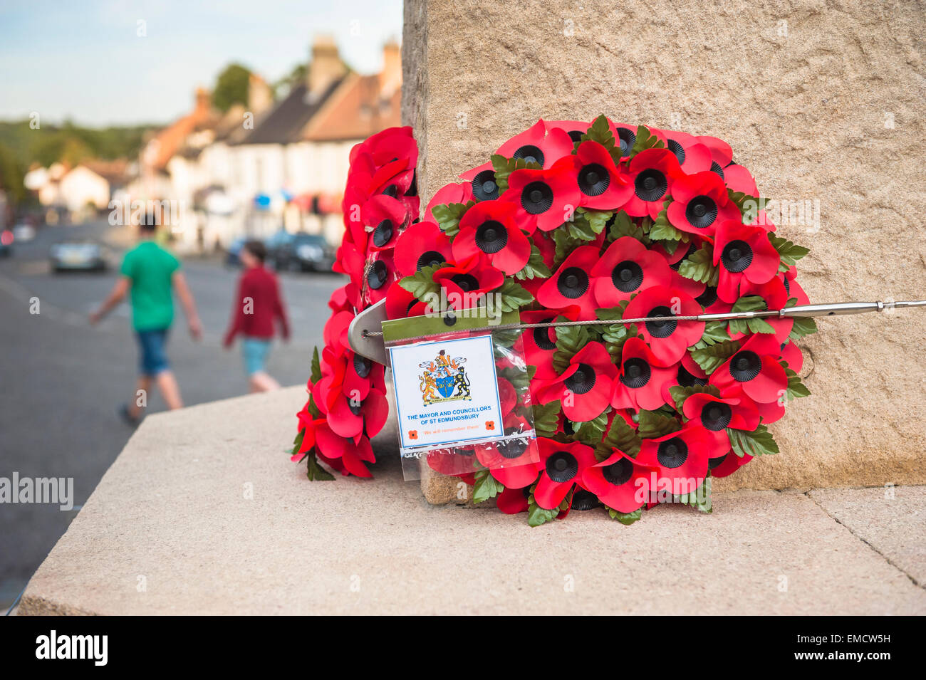 Poppies war memorial monument, on Angel Hill in Bury St. Edmunds poppy wreaths are left on the town's war memorial, Suffolk,UK Stock Photo