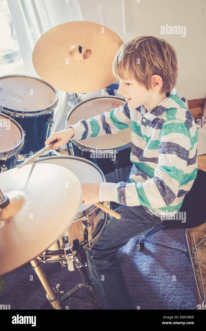 Boy playing drums Stock Photo