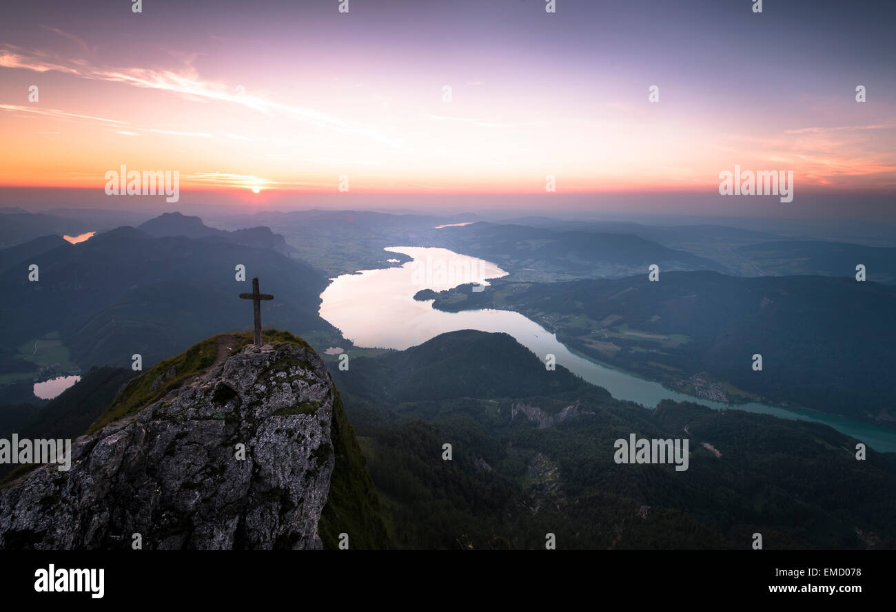 Austria, Salzkammergut, Mountain Schafberg, summit cross at sunset Stock Photo