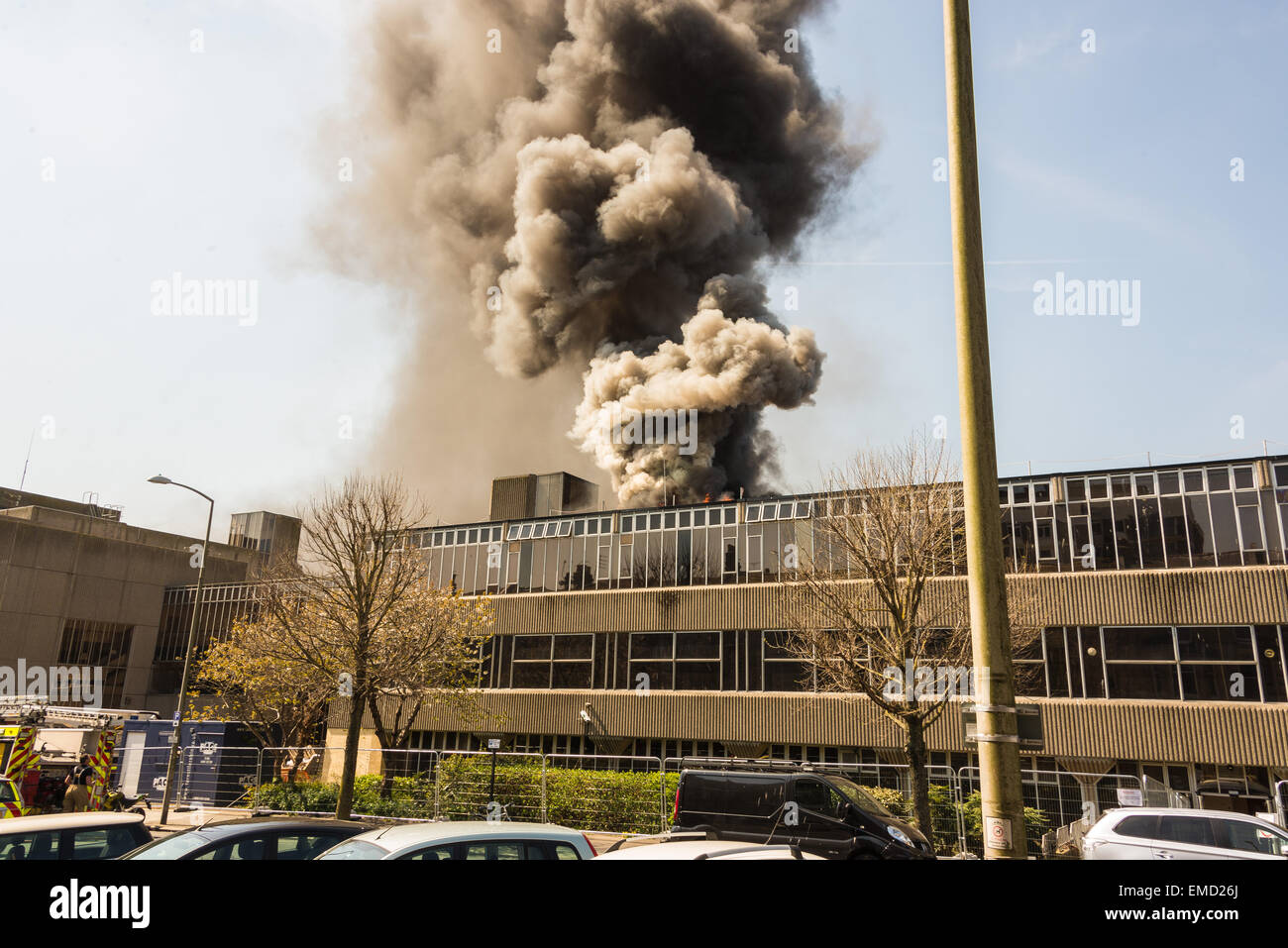 Brighton, UK. 20th Apr, 2015. Heavy smoke and flames as firefighters tackle a blaze at Hove Town Hall which broke out around lunchtime today. The Town Hall houses council offices and the police station. Credit:  Julia Claxton/Alamy Live News Stock Photo