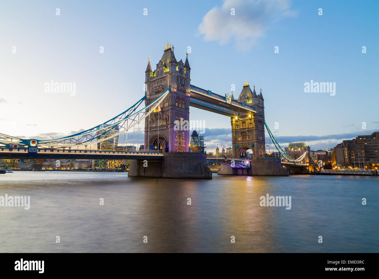 A view of Tower Bridge at Dusk. Buildings from the City of London can be seen in the background. Copyspace can be found in the w Stock Photo