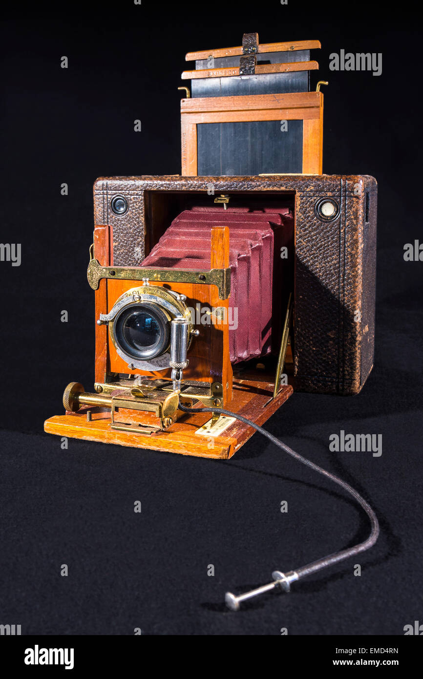 Old field camera in front of black background Stock Photo