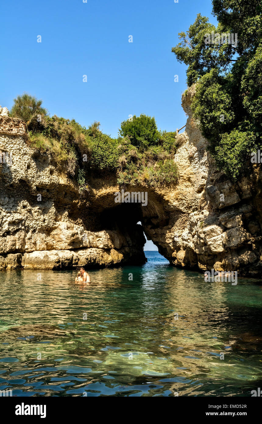 Queen Joan's baths is a natural basin and stone arch to the sea. It is on the site of a Roman villa and is a secret treasure. Stock Photo