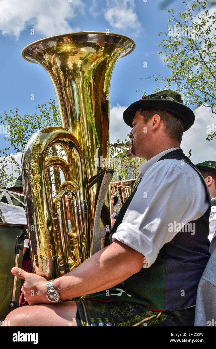 Bavarian brass band musician gold bass tuba at Miesbach 1st May maypole day Stock Photo