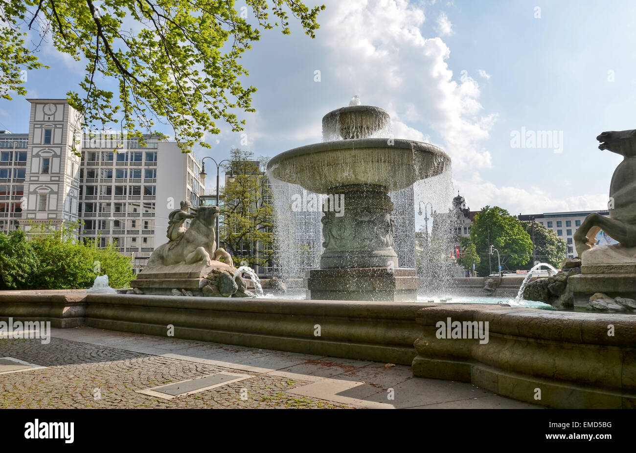 Allegory of the forces of water at the Lenbach Fountain at Munich, Maxburg in the background Stock Photo