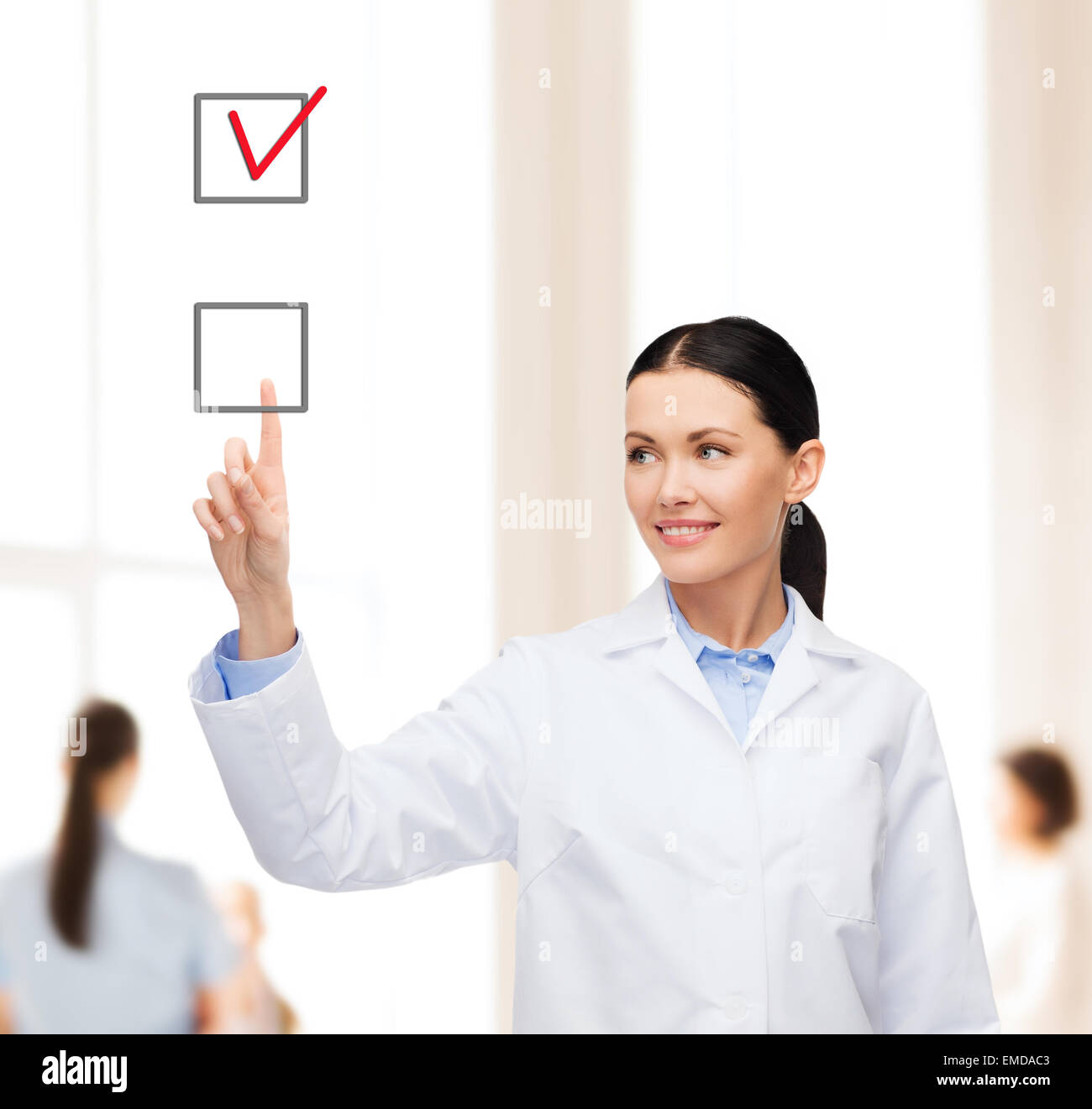 smiling female doctor pointing checkbox Stock Photo - Alamy