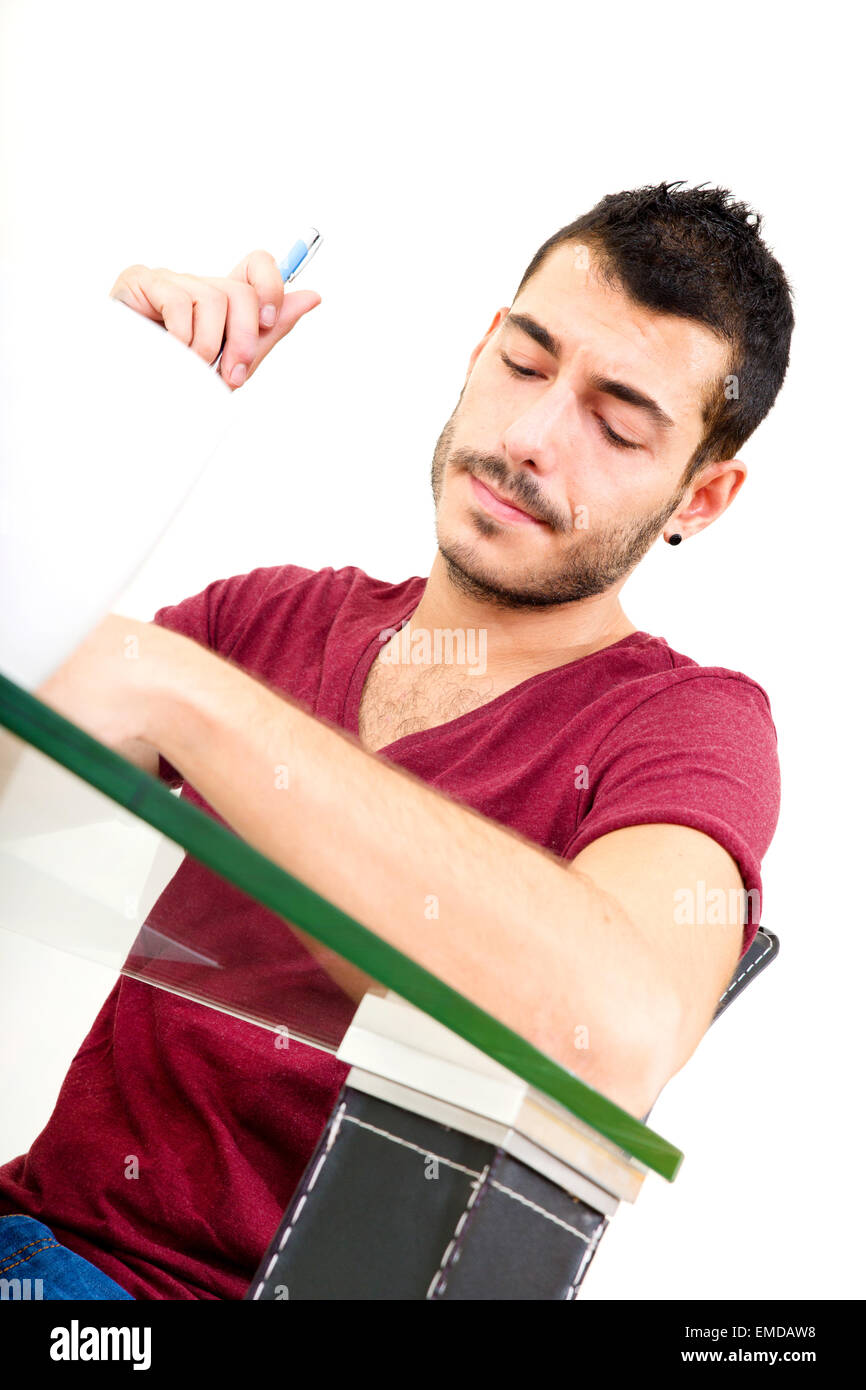 Portrait of a young man in red shirt sitting and thinking Stock Photo ...