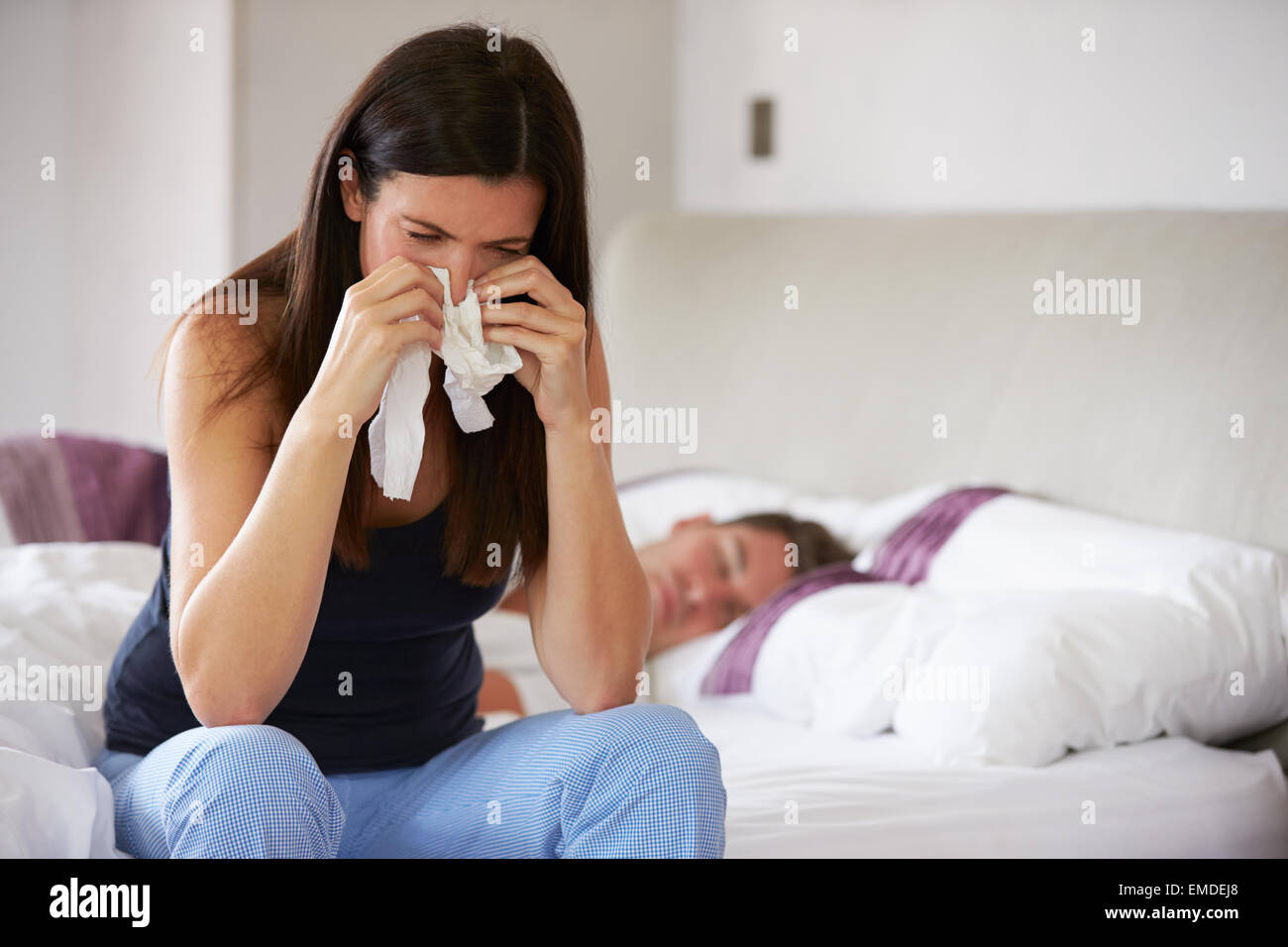 Woman Suffering From Depression Sitting On Bed And Crying Stock Photo ...