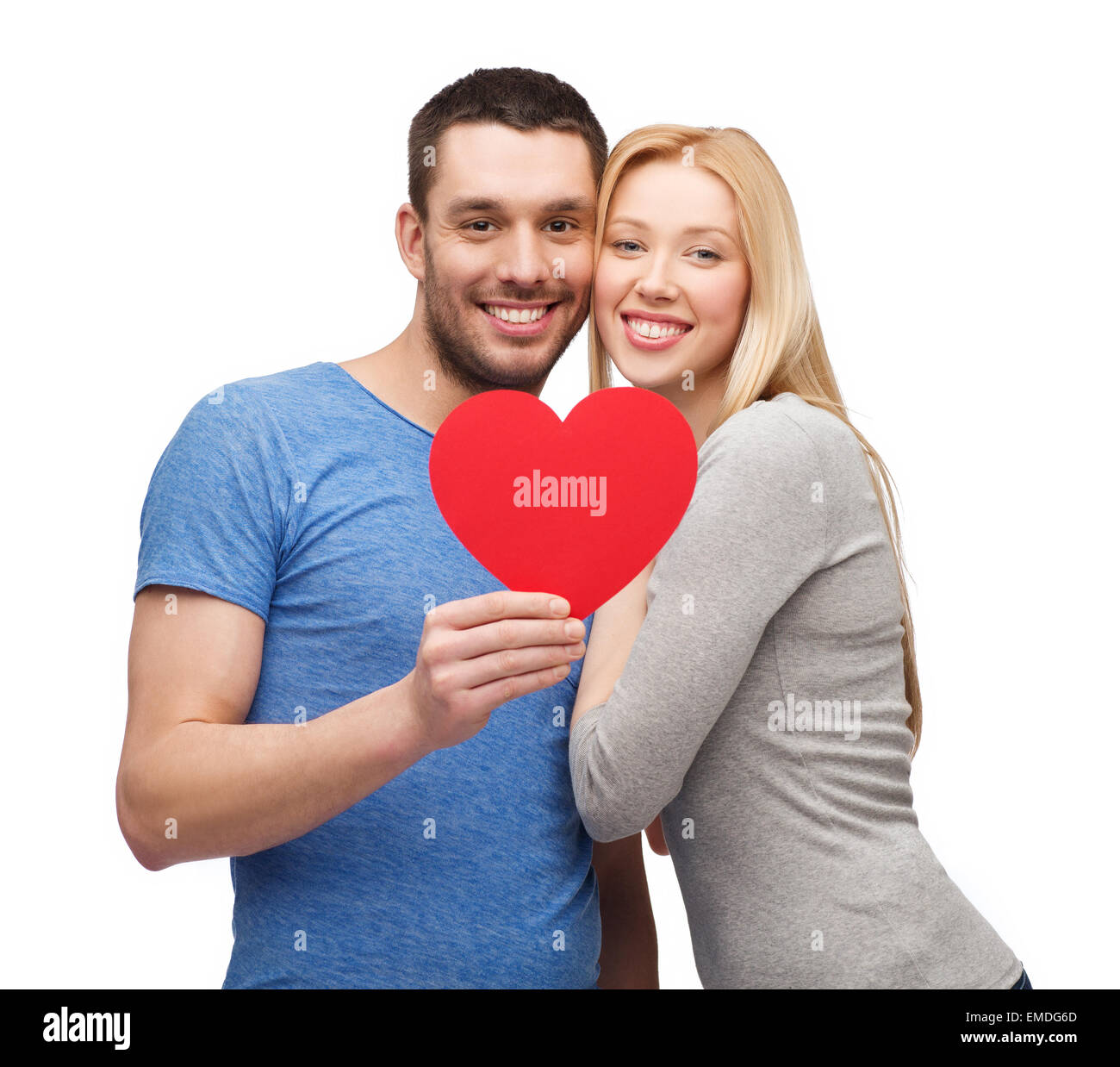 smiling couple holding big red heart Stock Photo - Alamy